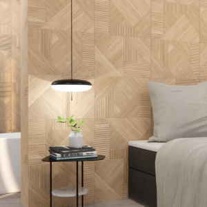Camera da letto elegante con rivestimento Essenza Nantes Fuoco effetto pietra nelle tonalità calde del fuoco, letto matrimoniale con biancheria beige e lampade a sospensione nere
