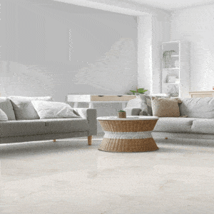 Soggiorno moderno con pavimento Invisibile, effetto pietra naturale chiara e atmosfera luminosa e minimalista